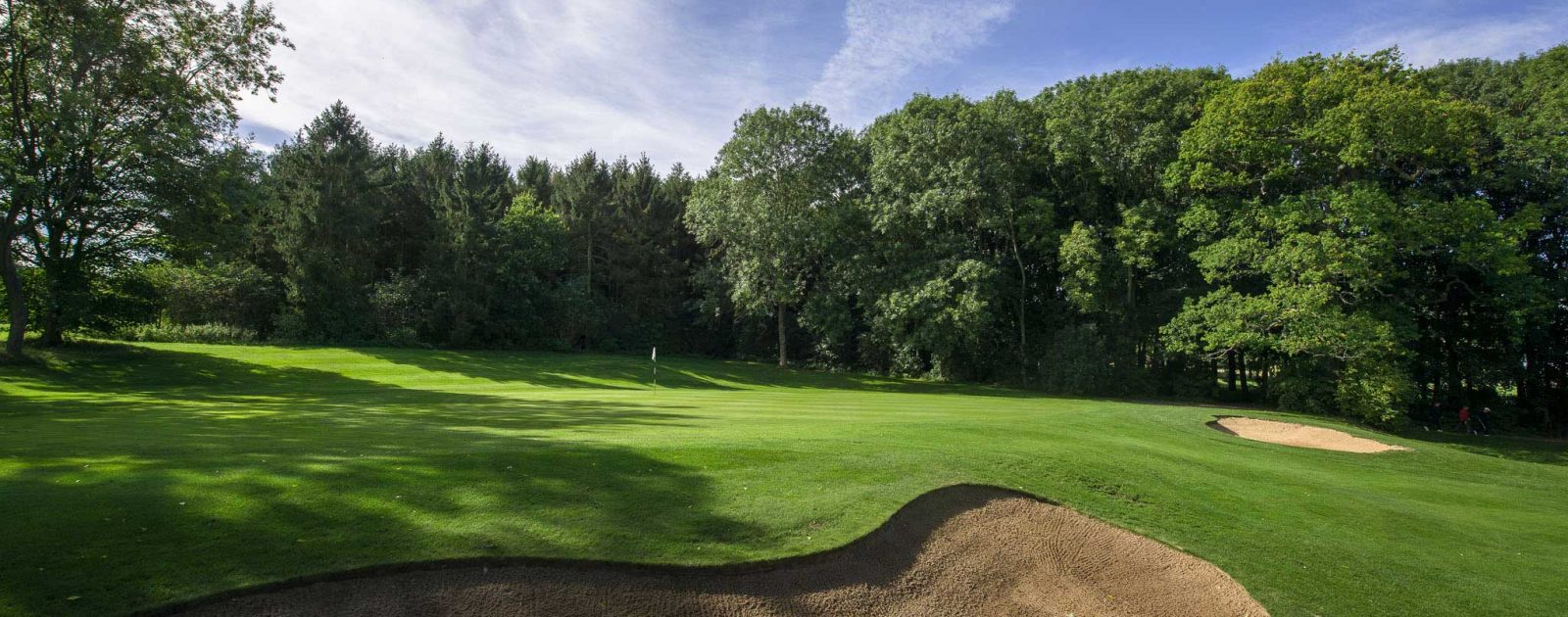 Redbourn Golf Club sloping green with bunker